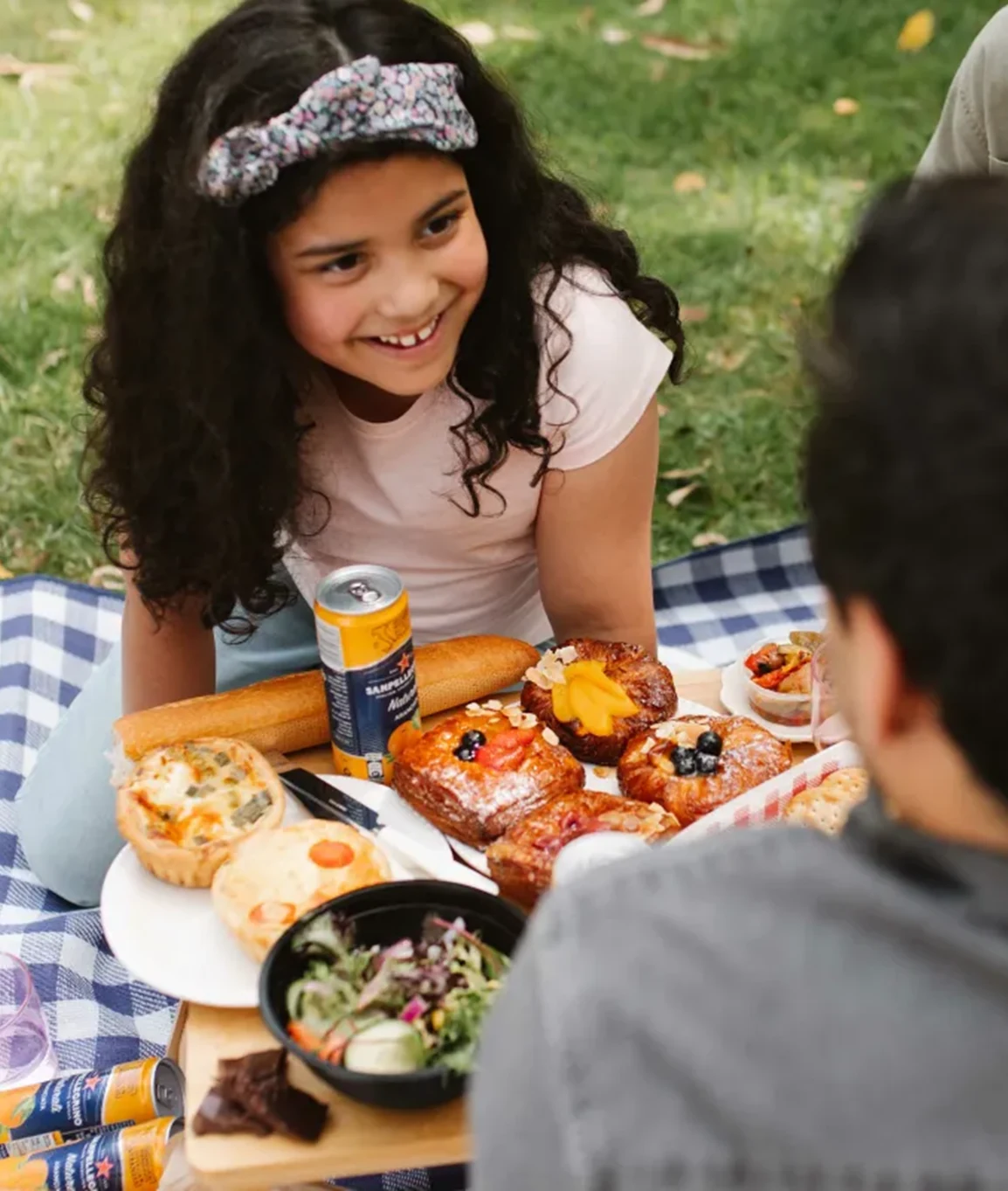 Family sharing a Mystery Picnic outdoors in Notting Hill